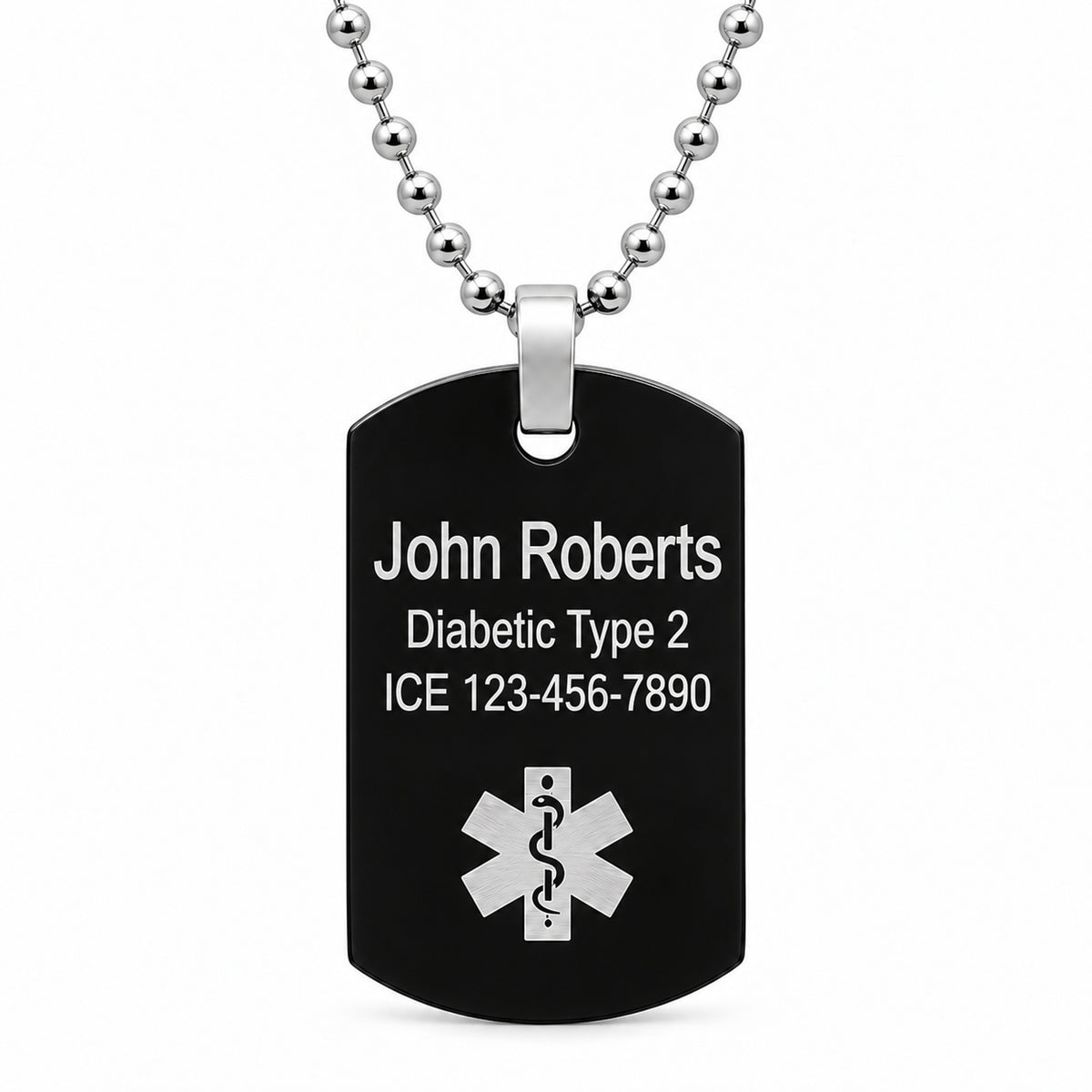 USMedID black medical dog tag with Arial sample engraving and a larger name; white text on a black plate.